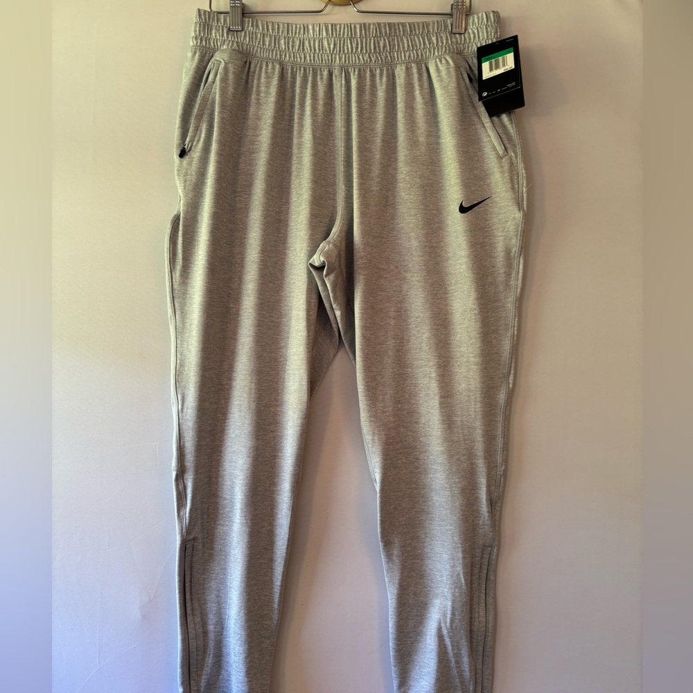 NEW Never Worn Nike Heather Gray Dri-FIT joggers W XL. Ankle zip and pockets.
